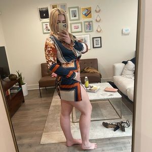 Bold print long sleeve mini dress with high slit